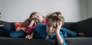 Winter Break Blues Bored kids laying on the couch.