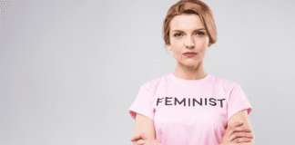A woman wearing a "feminist' t-shirt.
