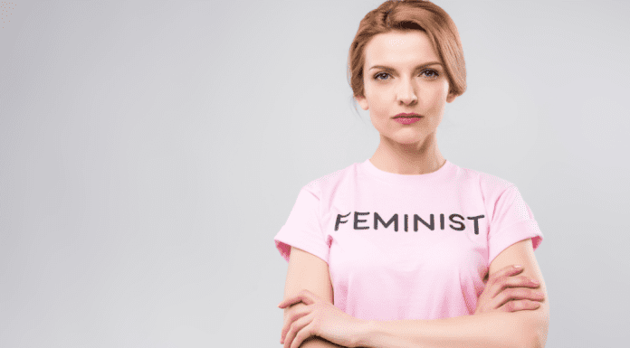 A woman wearing a "feminist' t-shirt.
