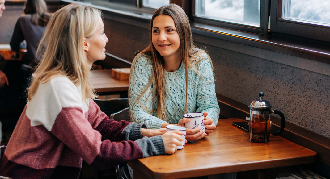 Two women having coffee. 