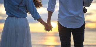 A couple holding hands.