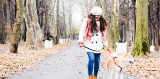 A Guide to Self-Care A woman walking her dog.