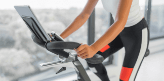 How My Bike Saved My Sanity A woman riding a stationary bike.