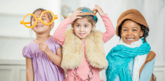 The Key to a Peaceful Play Date Kids playing dress-up during a play date.