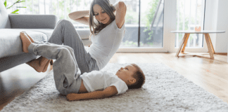 A mom exercising with her young son.