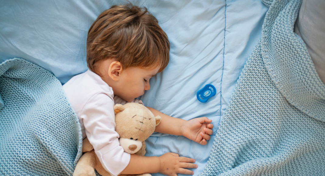 A toddler sleeping.