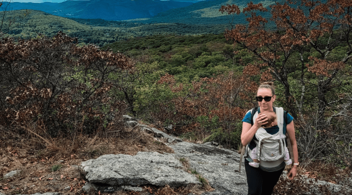 A woman hiking with her baby.