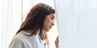 It’s Not You, It’s My Social Anxiety A woman looking out the window.