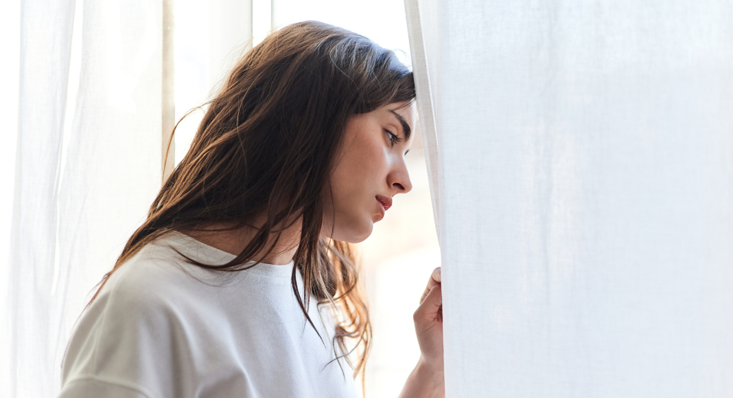 A woman looking out the window.