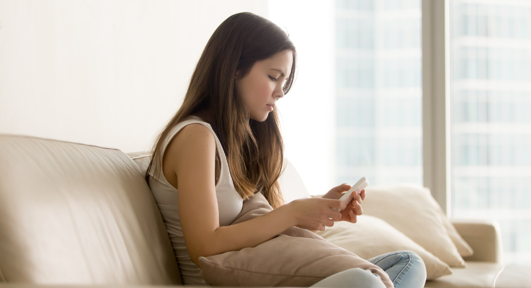 A teen on her phone.