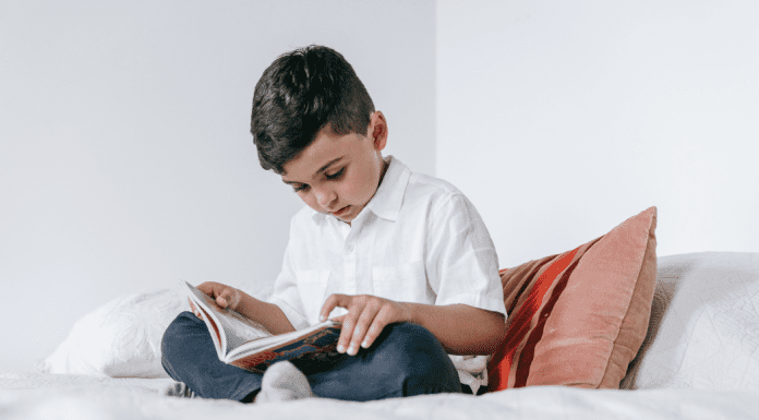 A boy reading a book.