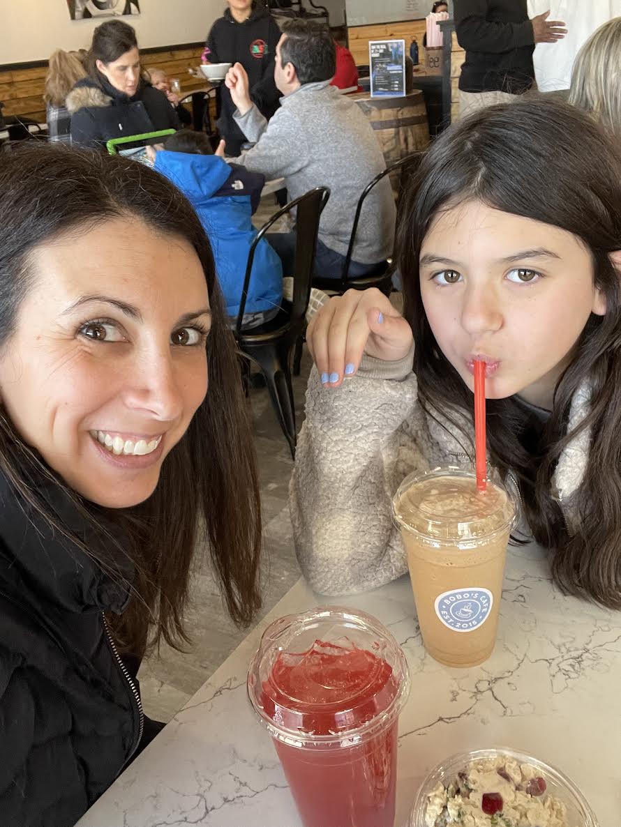 Mom and daughter at a coffee shop.