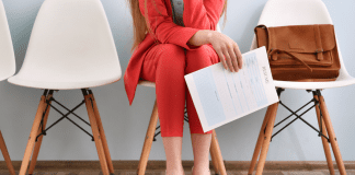 Best Mom Jobs: Family-Friendly Careers A woman holding a resume for a job interview.