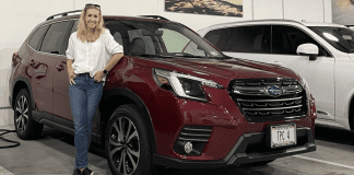 The 2023 Subaru Forester Jess at the Subaru White Plains dealership standing next to a 2023 Forester