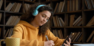 Parenting ADHD A girl being distracted while studying.