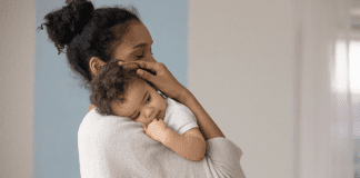 But Is He a Good Baby? A mother holding a baby.