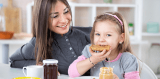 From Near Death to Testing Negative to Food Allergies A girl eating peanut butter.