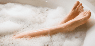 National Bubble Bath Day A woman's feet in a bubble bath.