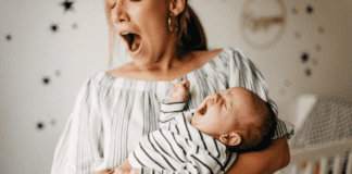 The Exhausted New Mom A mom and her baby yawning.