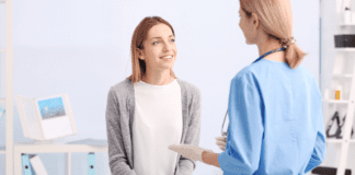A Dietitian’s Guide: Your Health Checklist A woman at a physical exam.
