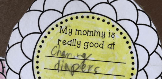 A school activity that a child writes, "My mommy is really good at changing diapers."