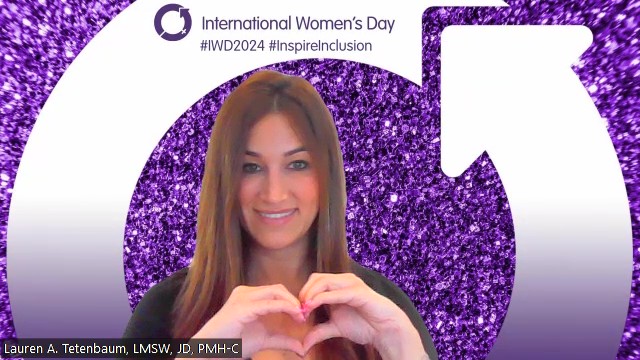Contributor Lauren making a heart with her hand for International Women's Day.