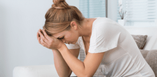 Westchester’s Privilege Bubble Isn’t Pretty A stressed woman holding her head.