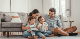 A family reading a book together.