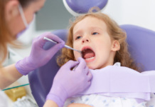 A Guide to Pediatric Care in Westchester County A girl getting a dental exam.