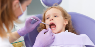 A girl getting a dental exam.