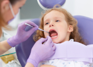 A Guide to Pediatric Care in Westchester County A girl getting a dental exam.