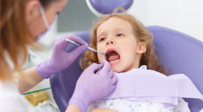 A girl getting a dental exam.