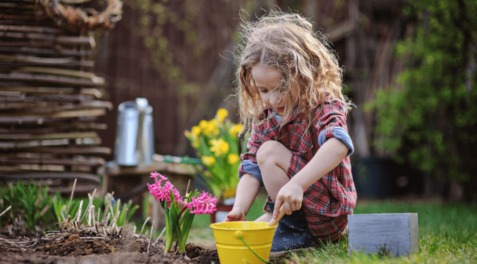 A girl planting flowers.