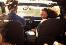 A family in a car on a road trip.