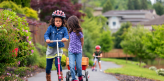 Kids riding their scooters outside during the spring.