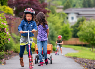 Spring Fever: Staying the Course Kids riding their scooters outside during the spring.