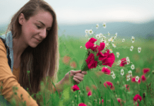 A women picking flowers.