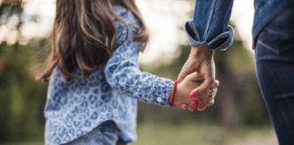 Finding the Beauty in the Unexpected: Meet Jennifer A mother and daughter holding hands.