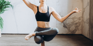 A woman doing yoga to find balance.