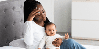 Ditching the Mommy Guilt A mom holding her baby.