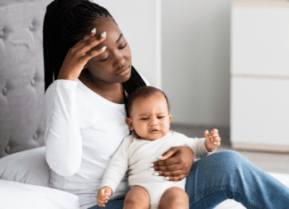 Ditching the Mommy Guilt A mom holding her baby.