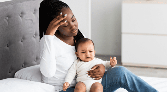 Ditching the Mommy Guilt A mom holding her baby.