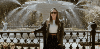 It Turns Out I Was Never Alone A woman standing alone in front of a water fountain.