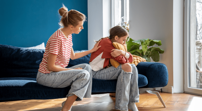 Mothering a Struggling Child A mother consoling a struggling child.