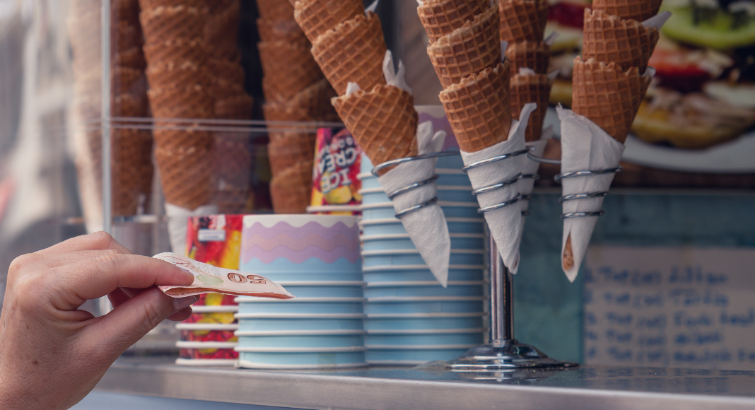 Paying for ice cream. 