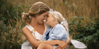 Know Your Worth A mom kissing her daughter's nose.