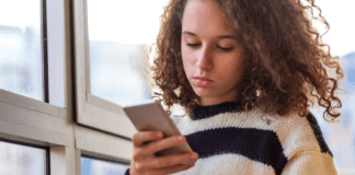 A tween on a cell phone.