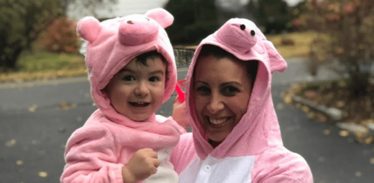 A mom and son dressed as pigs for Halloween.