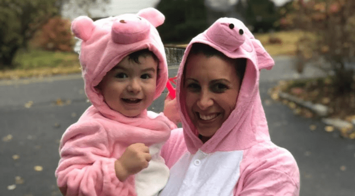 A mom and son dressed as pigs for Halloween.