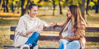 Forget Google, Ask a Mom Two moms talking on a park bench.